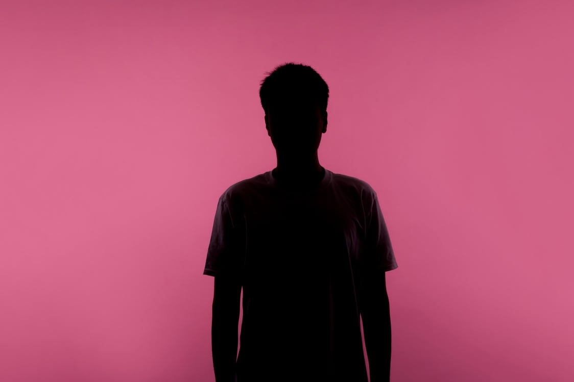 Silhouette of a Person on Pink Background